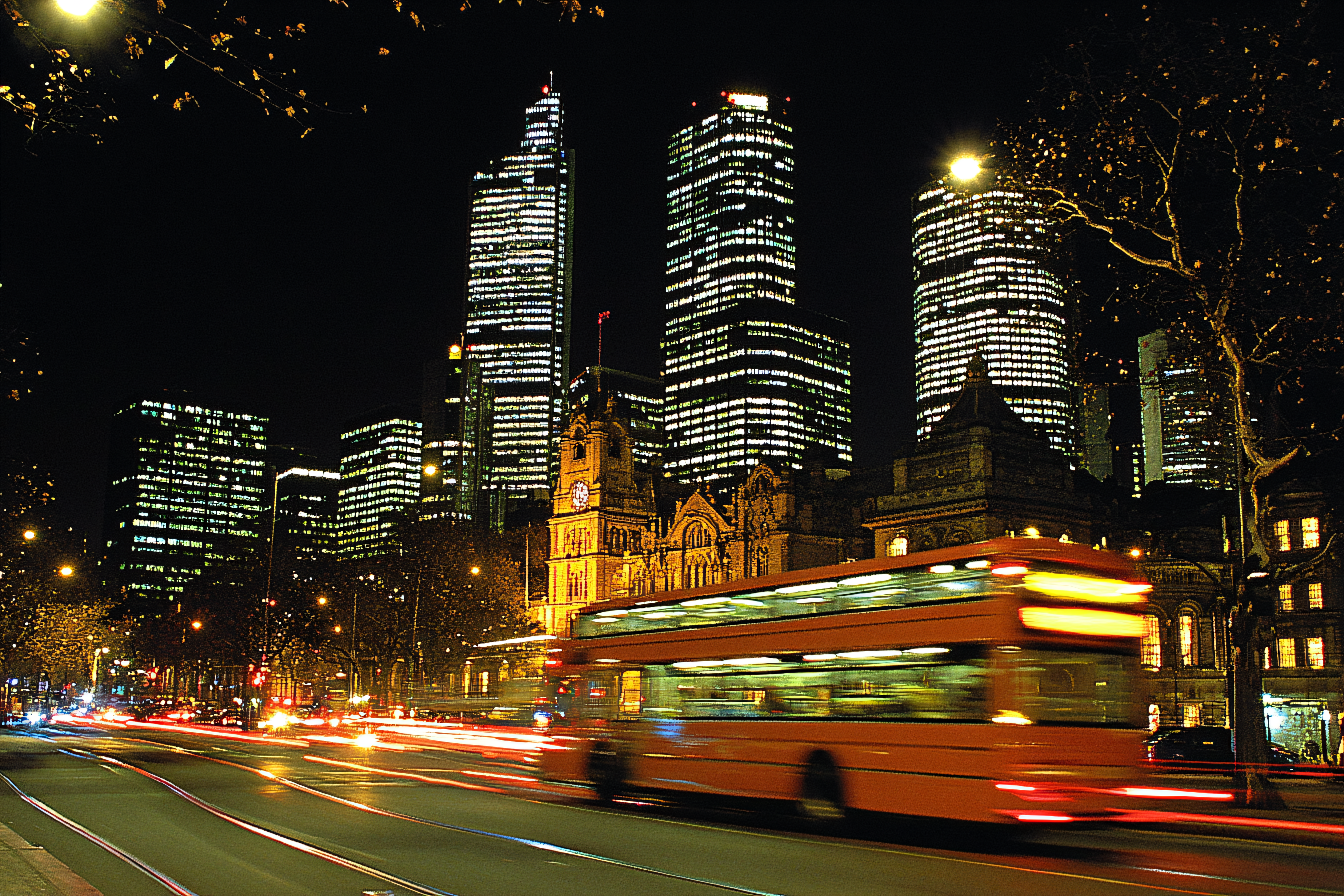Cityscape at Night with Double Decker Bus