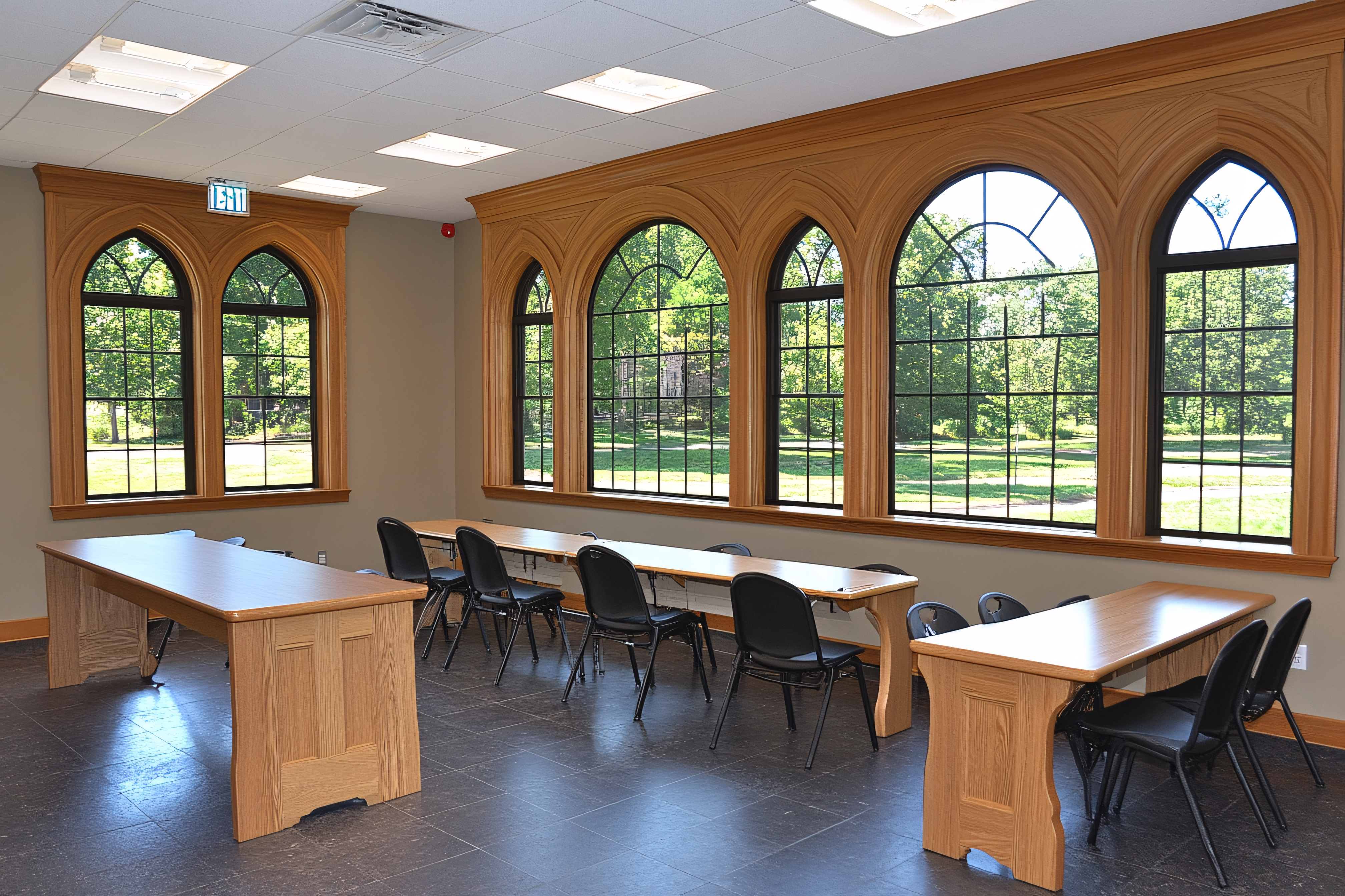 Classroom With Gothic Windows And Wooden Tables