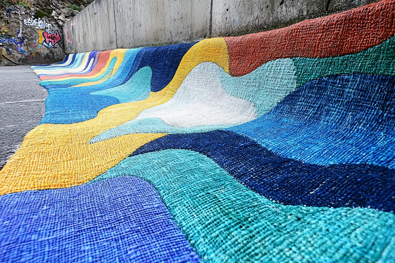 Colorful Woven Textile Art on Concrete Steps