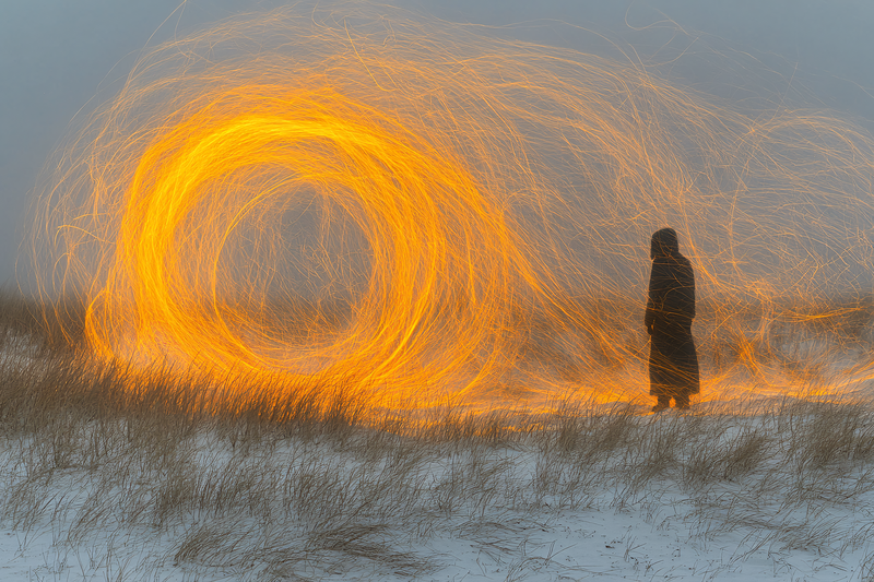Enigmatic Figure in Swirling Light