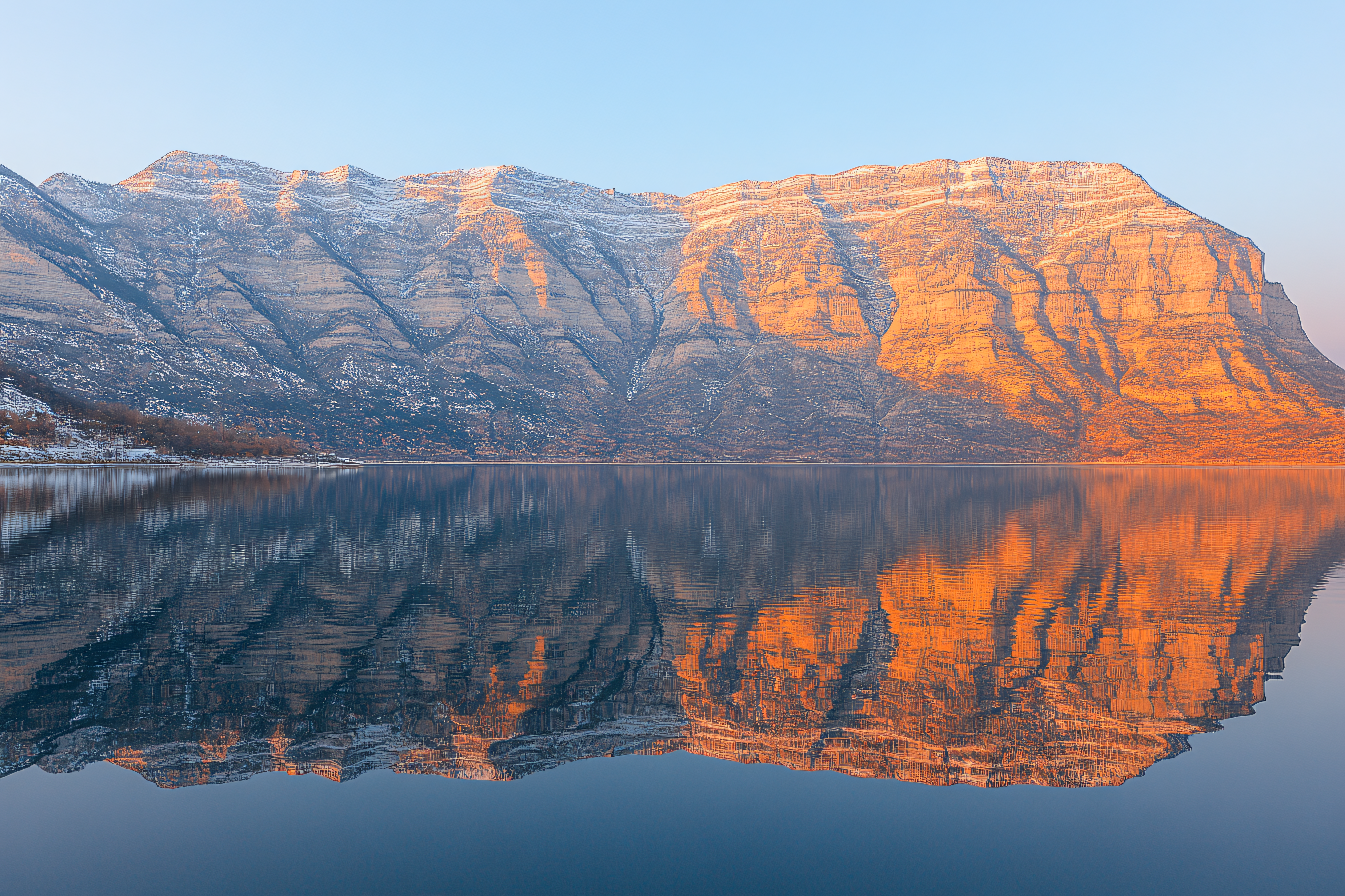 Mountain Reflection in Calm Lake at Sunrise