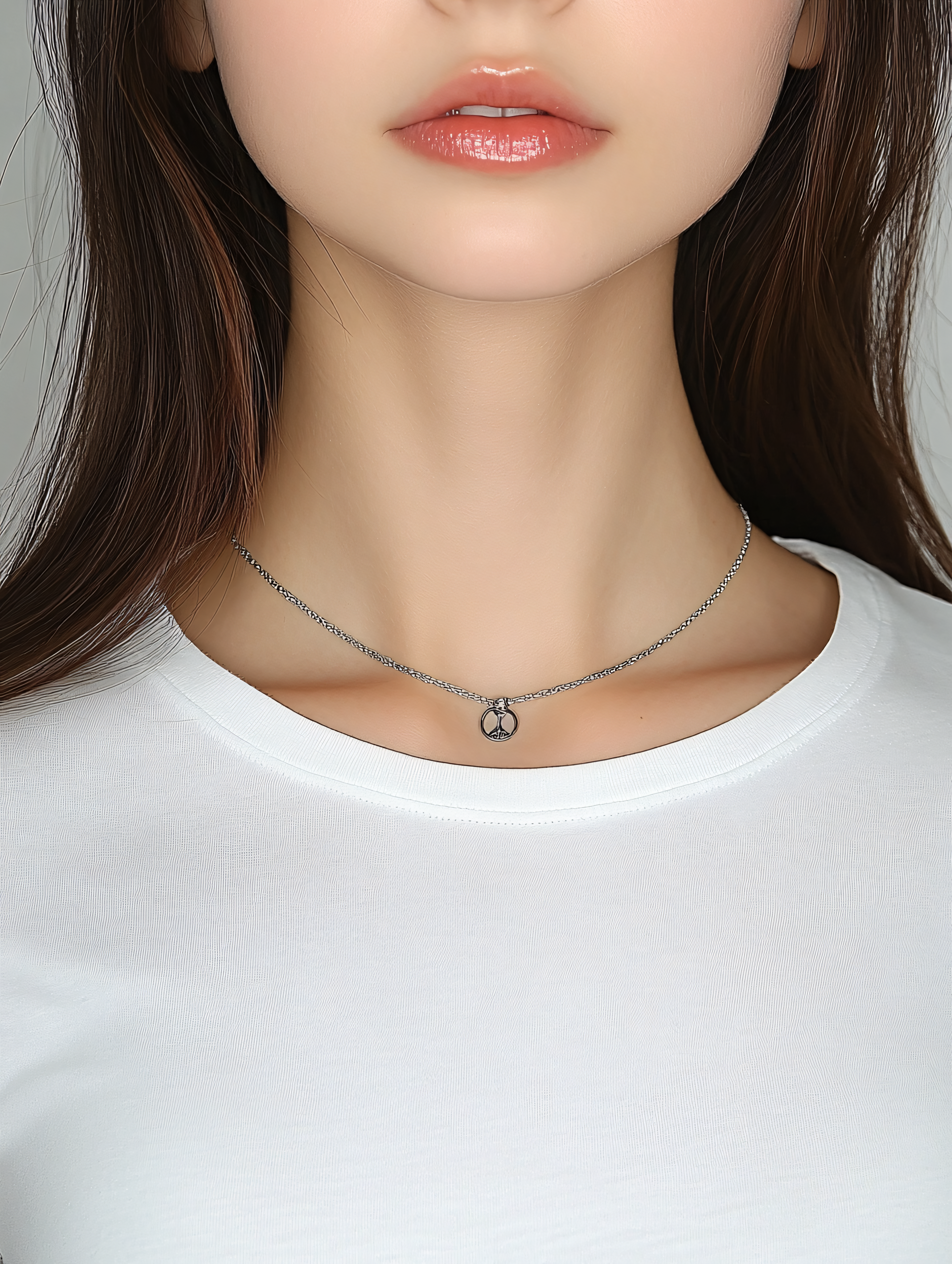 Woman Displaying Peace Symbol Necklace